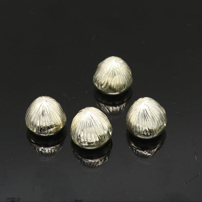 Sterling silver handmade Betal palm tree seed Supari, puja article from TRIBAL ORNAMENTS, used in worship and spiritual rituals.