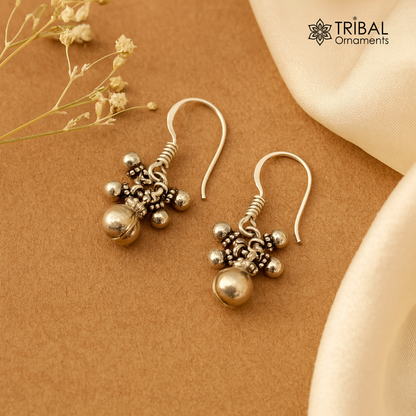 Traditional design 925 sterling silver hoops earrings with hanging bells and tribal style, crafted by TRIBAL ORNAMENTS.