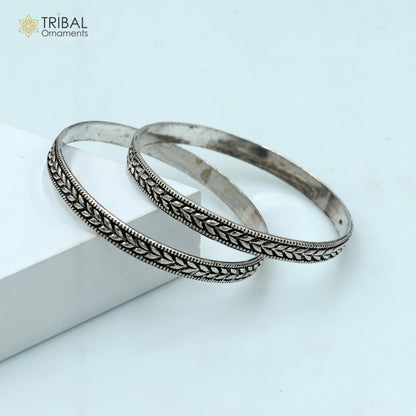 Trendy cultural design 925 sterling silver bangle bracelet by TRIBAL ORNAMENTS, featuring intricate handmade patterns for wedding jewelry.