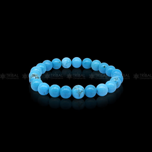 Turquoise crystal bracelet by Tribal Ornaments showcasing vibrant turquoise beads and silver accents on a neutral background.