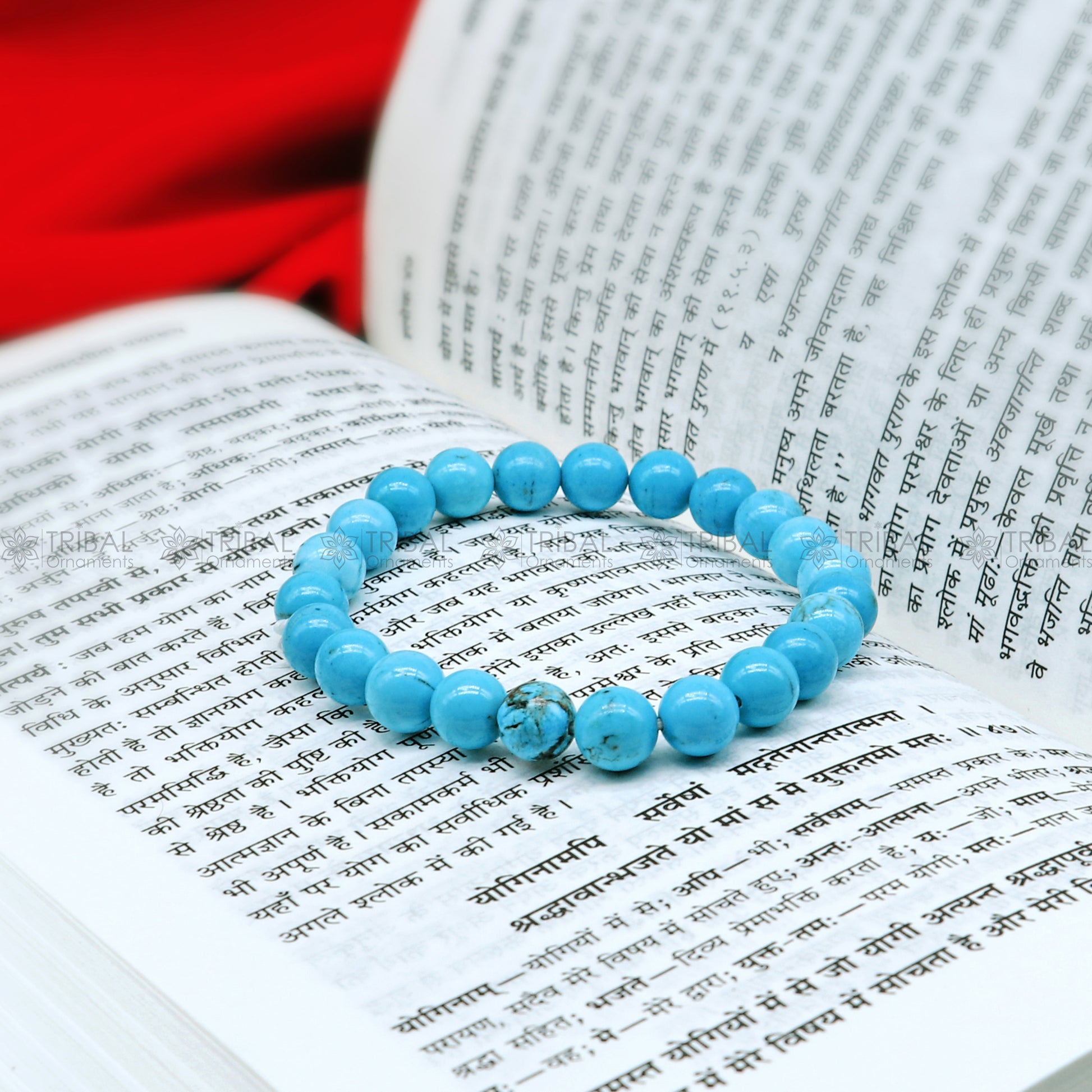 Turquoise crystal bracelet by TRIBAL ORNAMENTS featuring a beaded design that promotes healing and protection against negative energies.