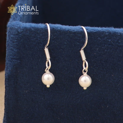 Sterling silver hoop earrings with lustrous pearl stones, lightweight and stylish, by TRIBAL ORNAMENTS.