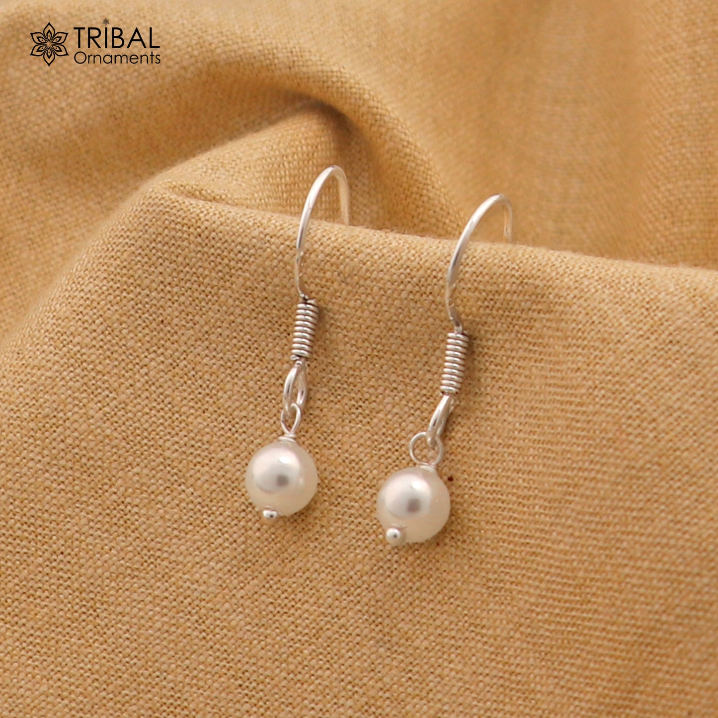 Sterling silver hoop earrings with pearl stones, lightweight and stylish, featuring delicate and elegant jewelry design by Tribal Ornaments.