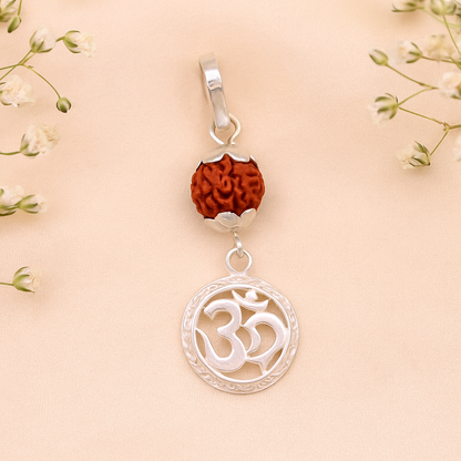 Vintage solid silver Aum pendant with natural rudraksh beads, handcrafted tribal jewelry featuring intricate design details.