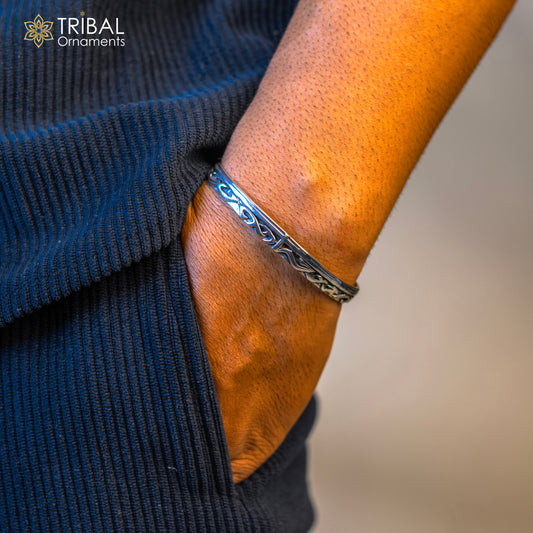 Vintage-style 925 sterling silver adjustable cuff bracelet by Tribal Ornaments, unisex handmade jewelry with antique detailing.