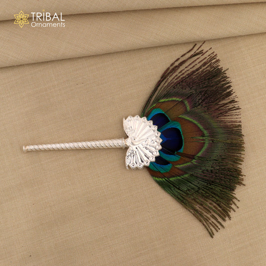 Handmade vintage silver Mor Chhadi with peacock feather, Lord Krishna Laddu Gopal gift, featuring intricate tribal ornament design.