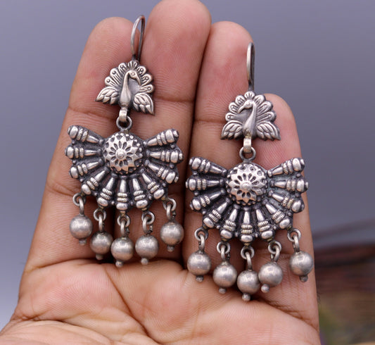Vintage sterling silver peacock hoop earrings with hanging bells, tribal jewelry handcrafted for belly dance and Indian-inspired style.