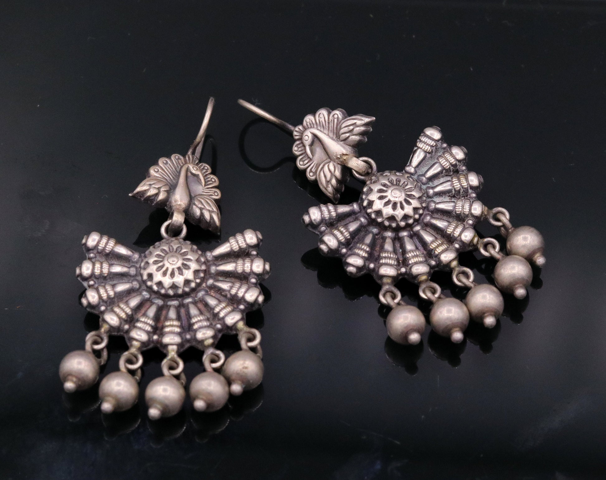 Vintage sterling silver peacock hoop earrings with hanging bells, tribal jewelry design perfect for belly dance or Indian traditional wear.