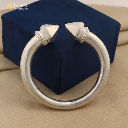 Vintage tribal design sterling silver bangle cuff by TRIBAL ORNAMENTS, showcasing intricate handmade unisex jewelry craftsmanship.