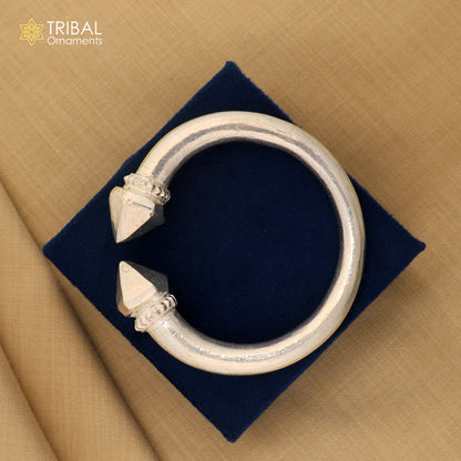 Vintage-style solid sterling silver bangle cuff from Tribal Ornaments, showcasing intricate tribal design and unisex jewelry craftsmanship.