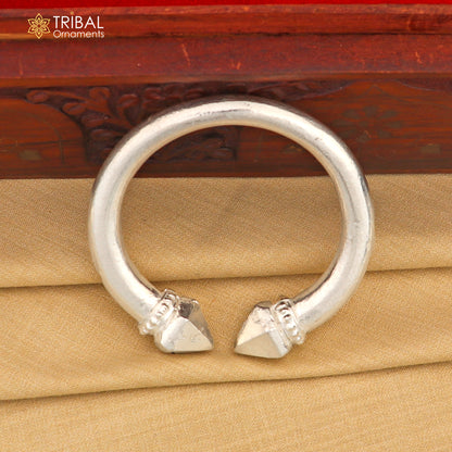 Vintage sterling silver tribal bangle cuff from TRIBAL ORNAMENTS, featuring a heavy, handcrafted unisex tribal jewelry design.