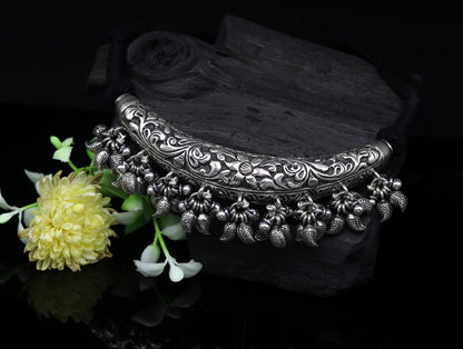 Vintage Indian tribal silver charm necklace with customized chitai and kandrai work, featuring traditional tribal jewelry style.