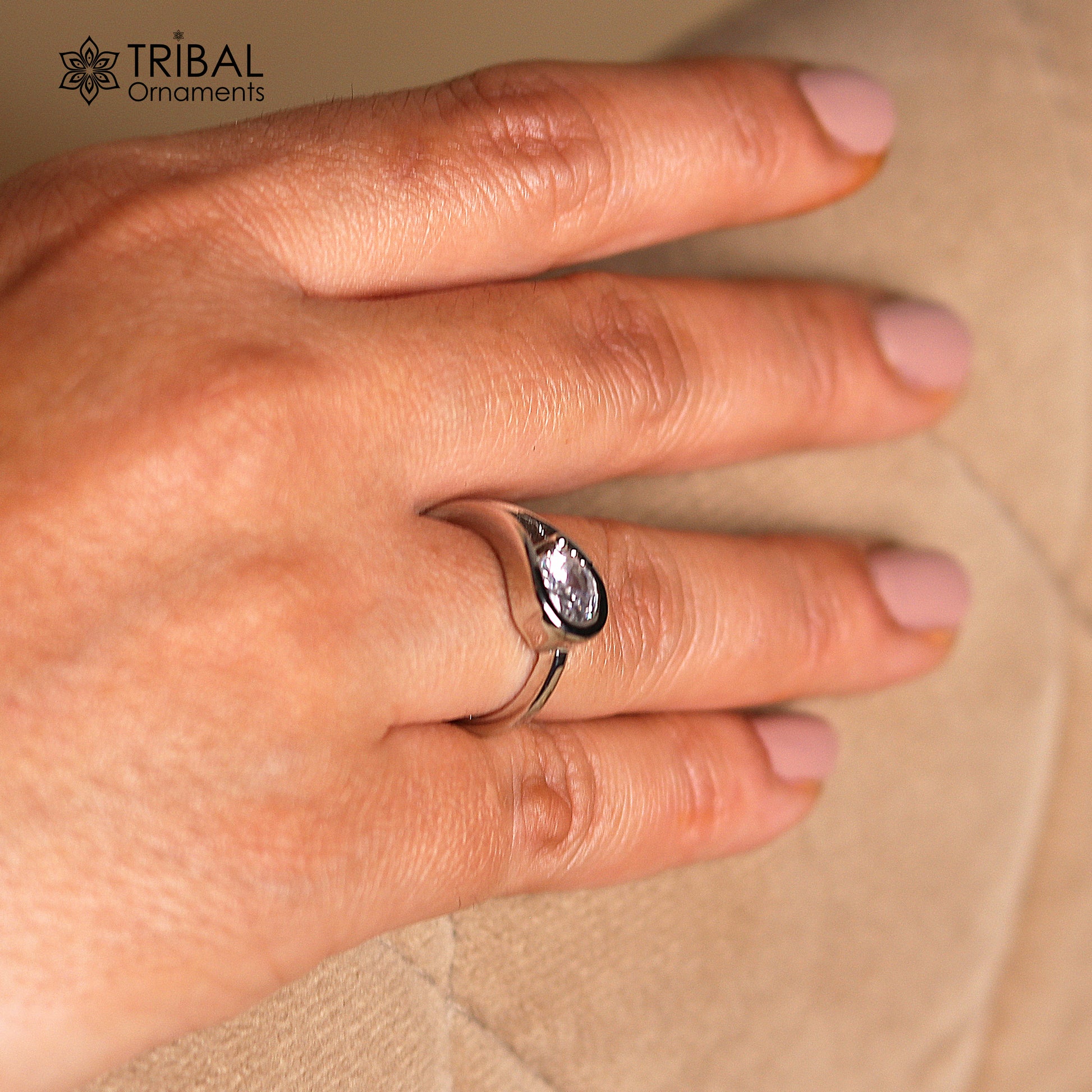 White stone stylish silver ring by TRIBAL ORNAMENTS featuring a sleek band and intricate tribal design.