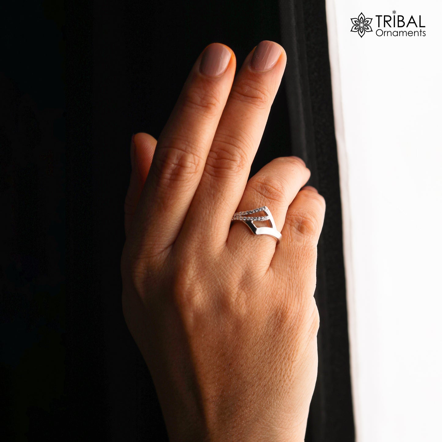White stone stylish silver ring by TRIBAL ORNAMENTS featuring intricate tribal design and polished silver band.