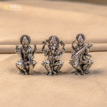 Small 2-inch handmade 925 sterling silver Hindu idols of Ganesha, Lakshmi, and Saraswati for puja rituals by TRIBAL ORNAMENTS.