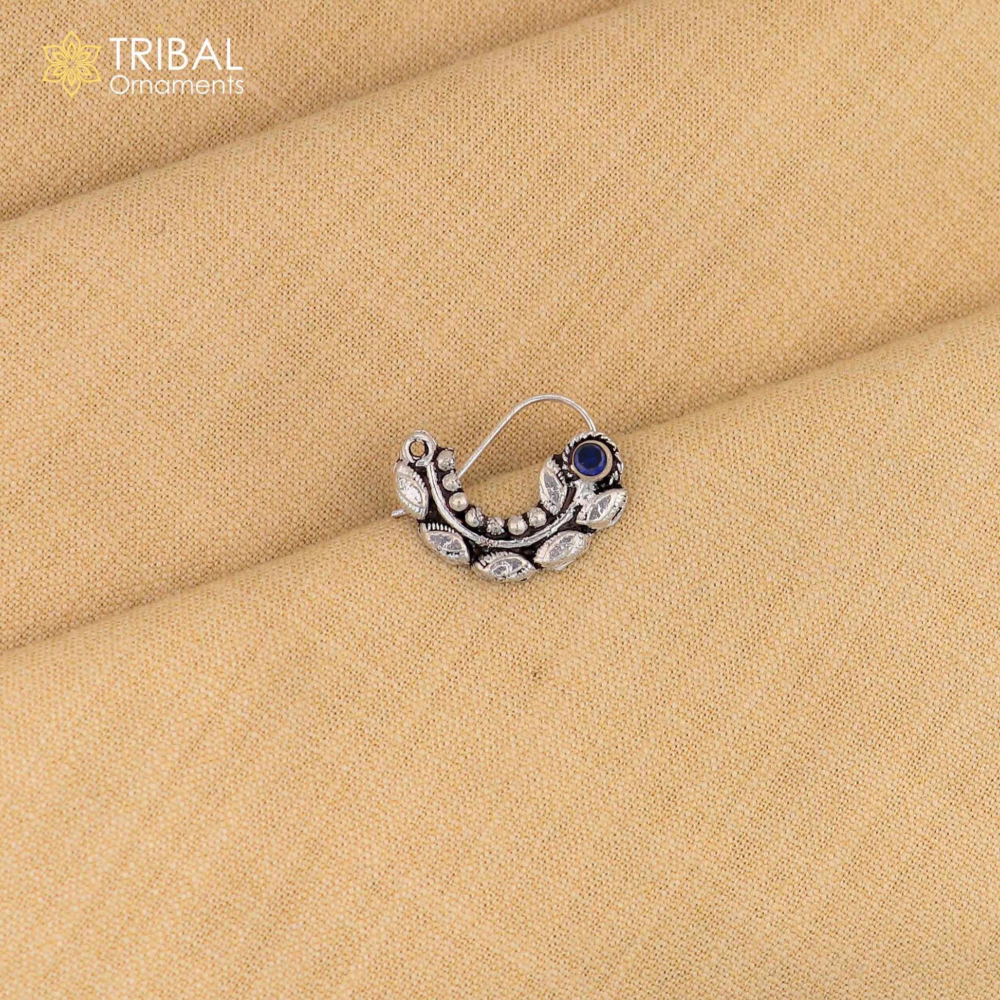 Sterling silver vintage leaf-shaped nose pin with pearl and stone accents, tribal ornamental jewelry design.