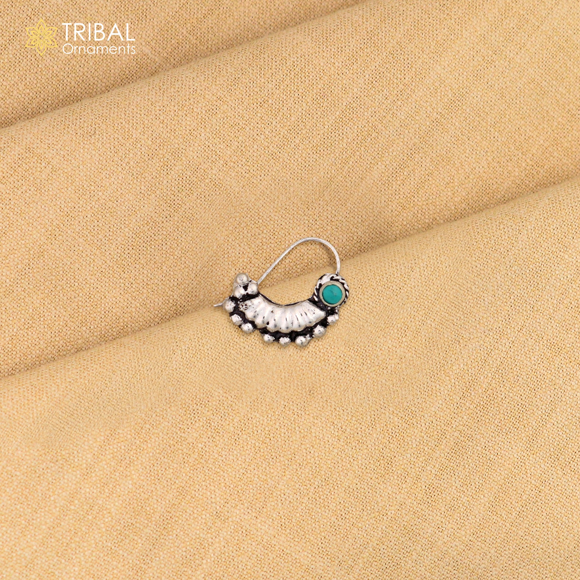 Sterling silver tribal nose pin with vintage design and white stone, featuring ethnic tribal jewelry craftsmanship.