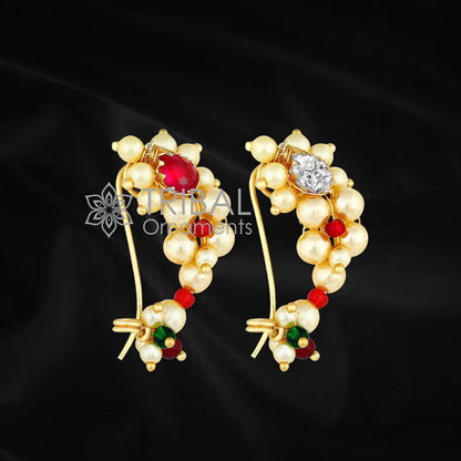 Traditional Indian nose pin in 18k yellow gold with pearl and white stone, handcrafted tribal jewelry from Maharashtra.