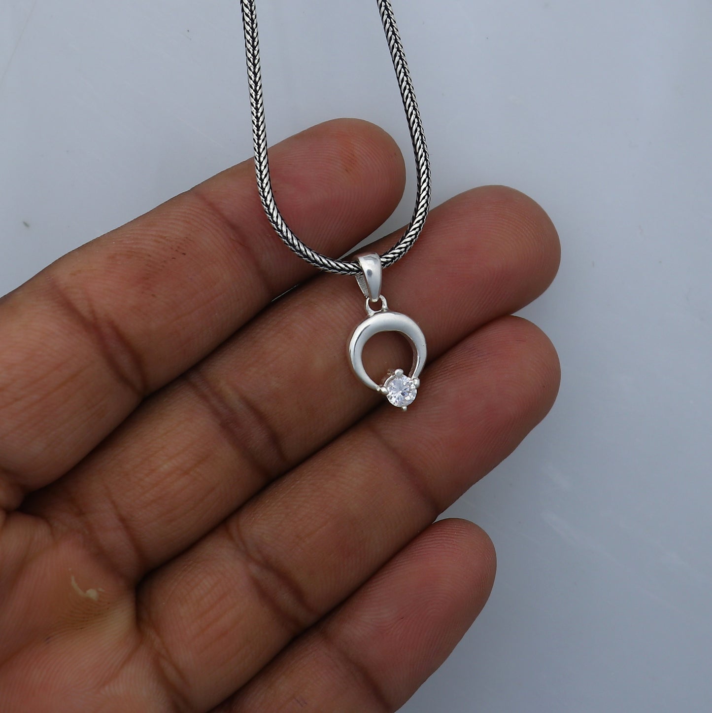 925 Sterling silver diamond pendant with antique tribal design, featuring intricate craftsmanship and sparkling gemstone details.