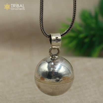 Sterling silver dog jingling pendant with ball design and chain, tribal jewelry style by TRIBAL ORNAMENTS.