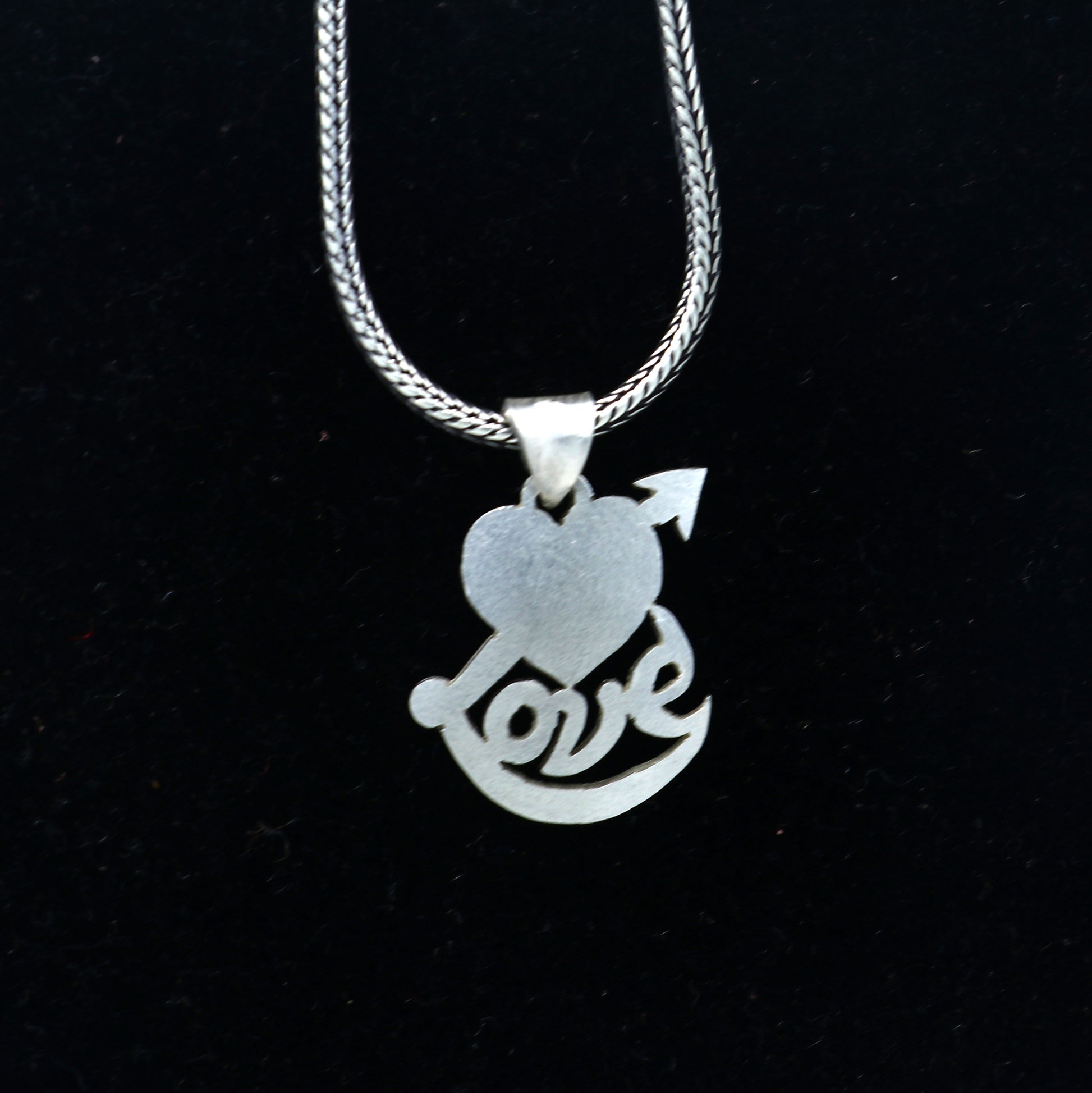 925 Sterling silver pendant with diamond heart and love design from TRIBAL ORNAMENTS, showcasing intricate craftsmanship and sparkling accents.