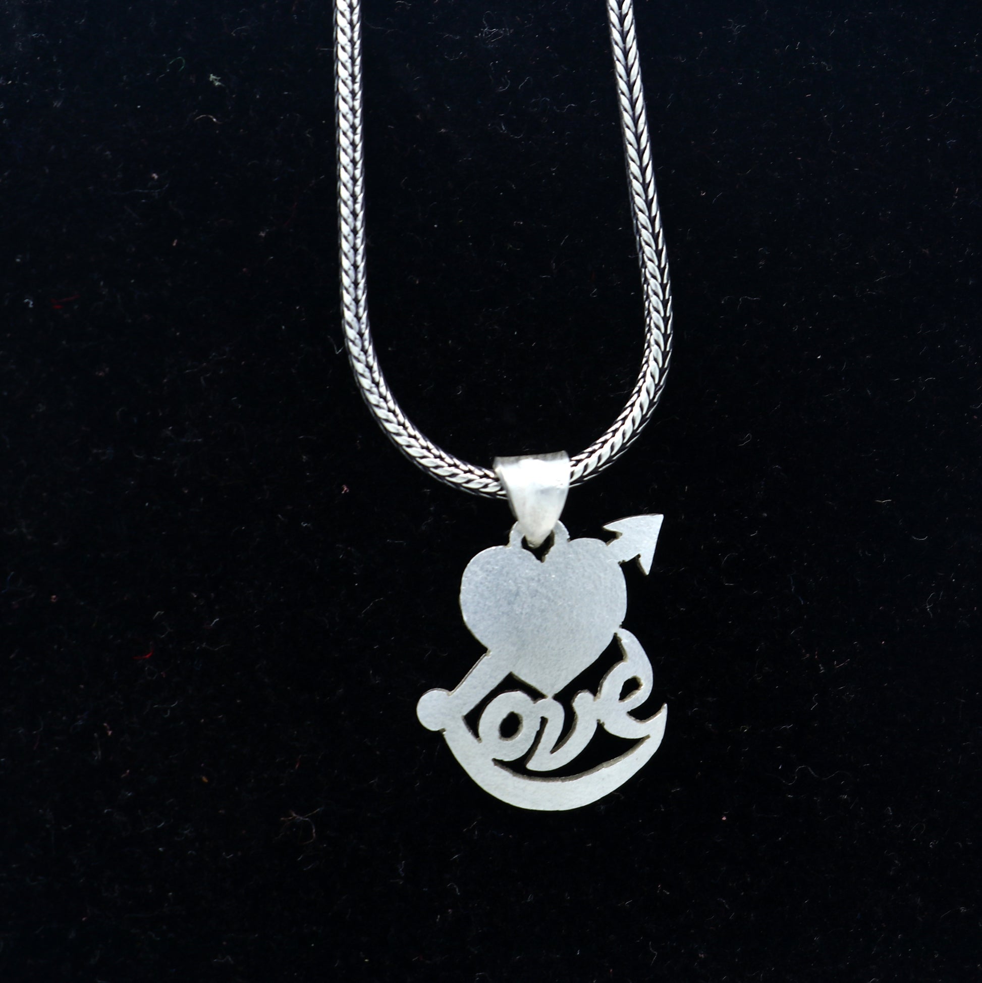 925 Sterling silver pendant featuring a diamond heart and love design, crafted by TRIBAL ORNAMENTS.