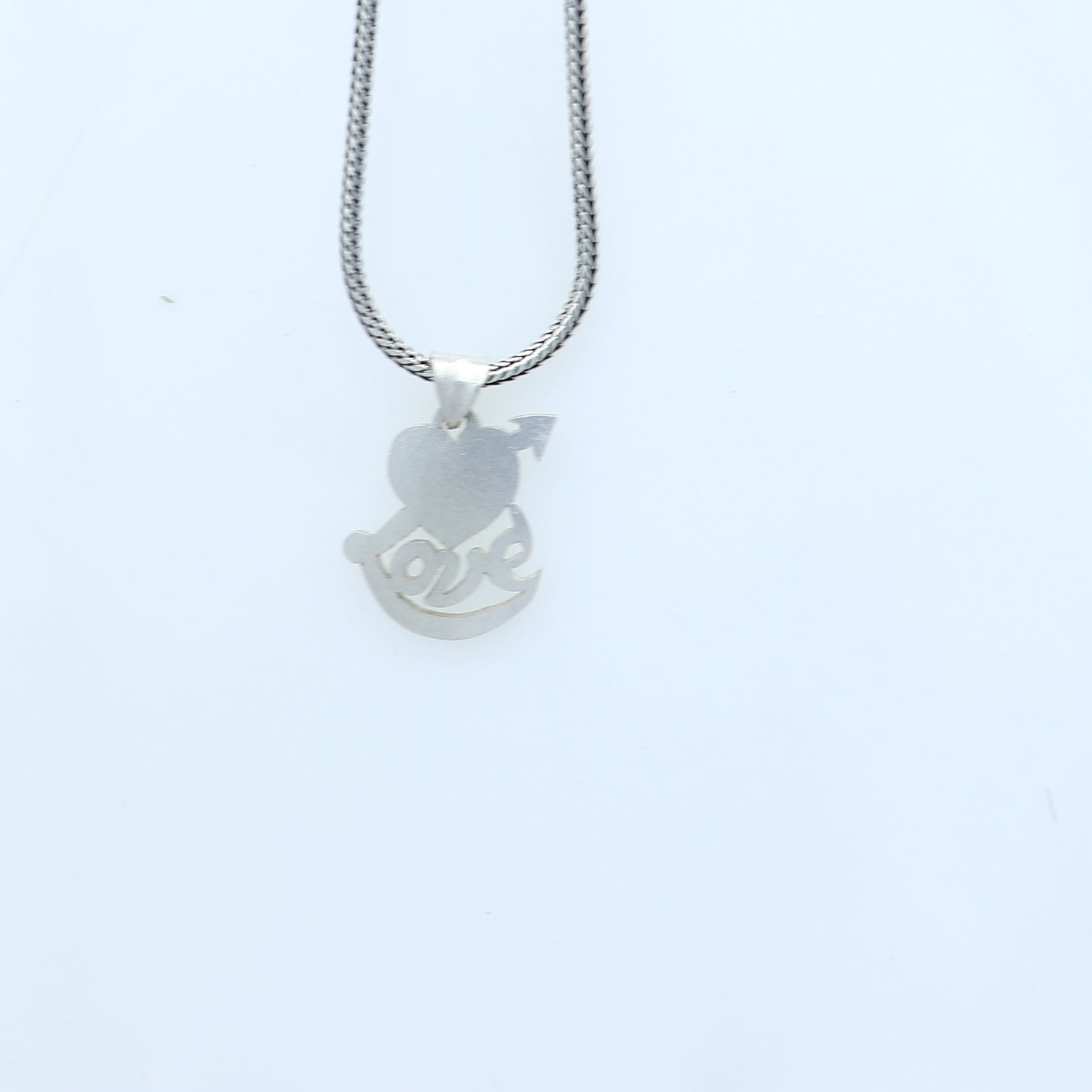 925 Sterling silver pendant with diamond heart and love design, crafted by TRIBAL ORNAMENTS, showcasing intricate jewelry details