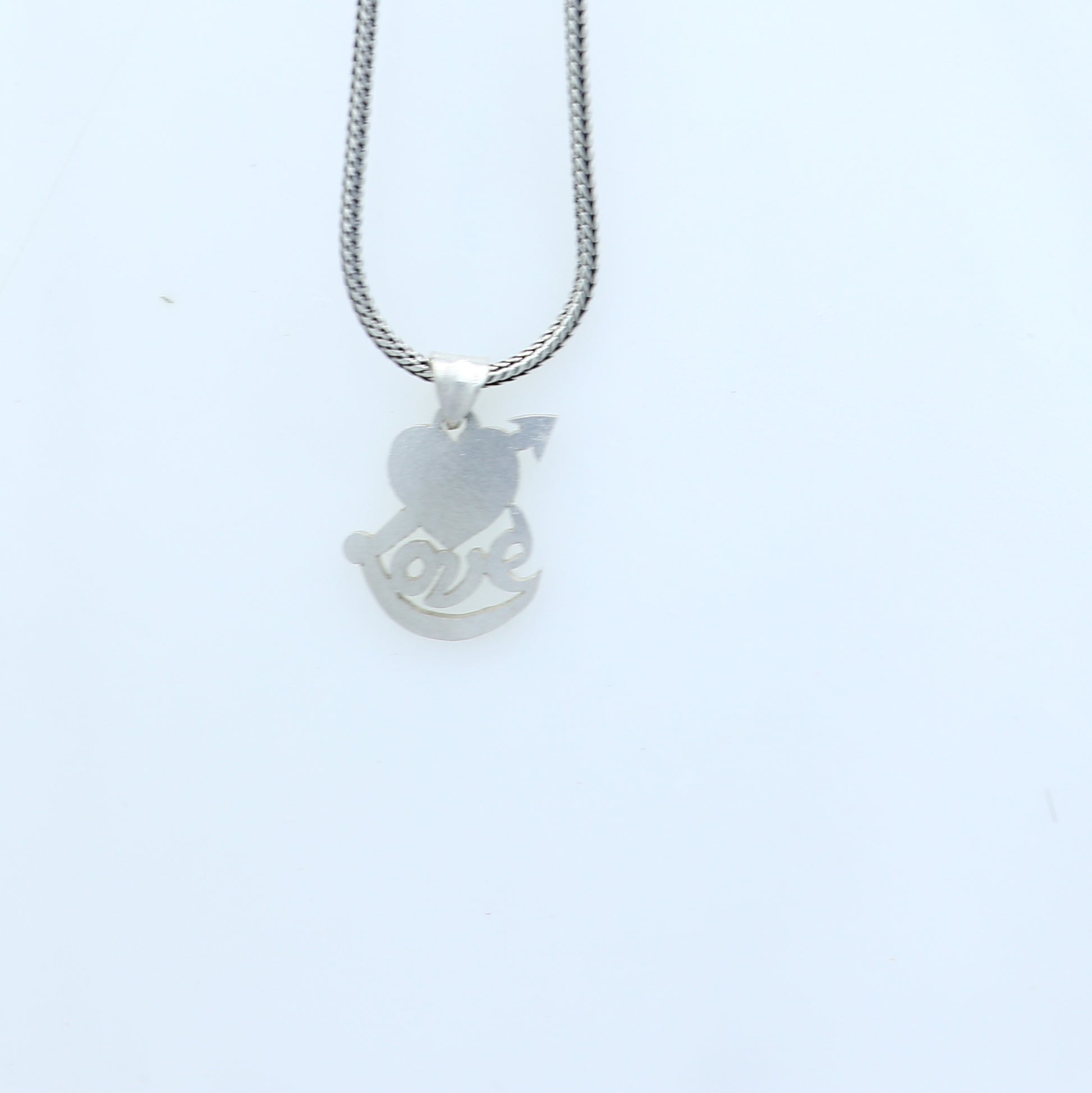 925 Sterling silver pendant with diamond heart and love design, crafted by TRIBAL ORNAMENTS, showcasing intricate jewelry details