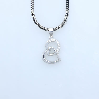 925 Sterling silver heart-shaped pendant with diamond accents from TRIBAL ORNAMENTS, showcasing intricate tribal-inspired design.