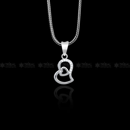 Sterling silver heart pendant with diamond accents from TRIBAL ORNAMENTS, featuring a detailed tribal design and a polished finish.
