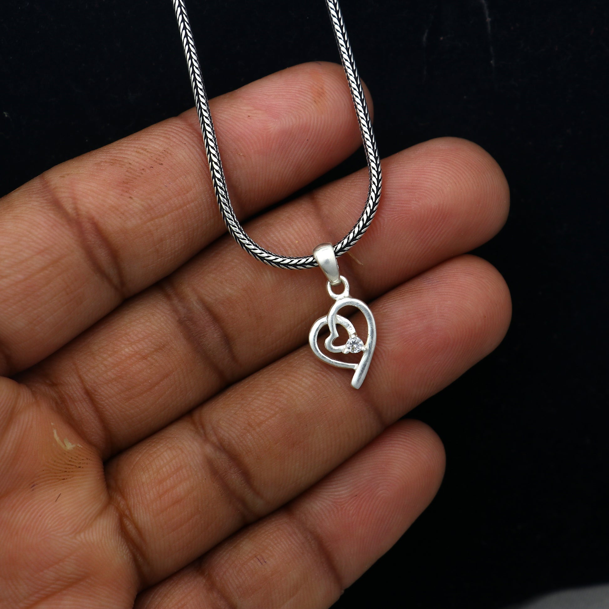 925 Sterling silver diamond heart pendant by TRIBAL ORNAMENTS with intricate heart design and sparkling diamond accents.