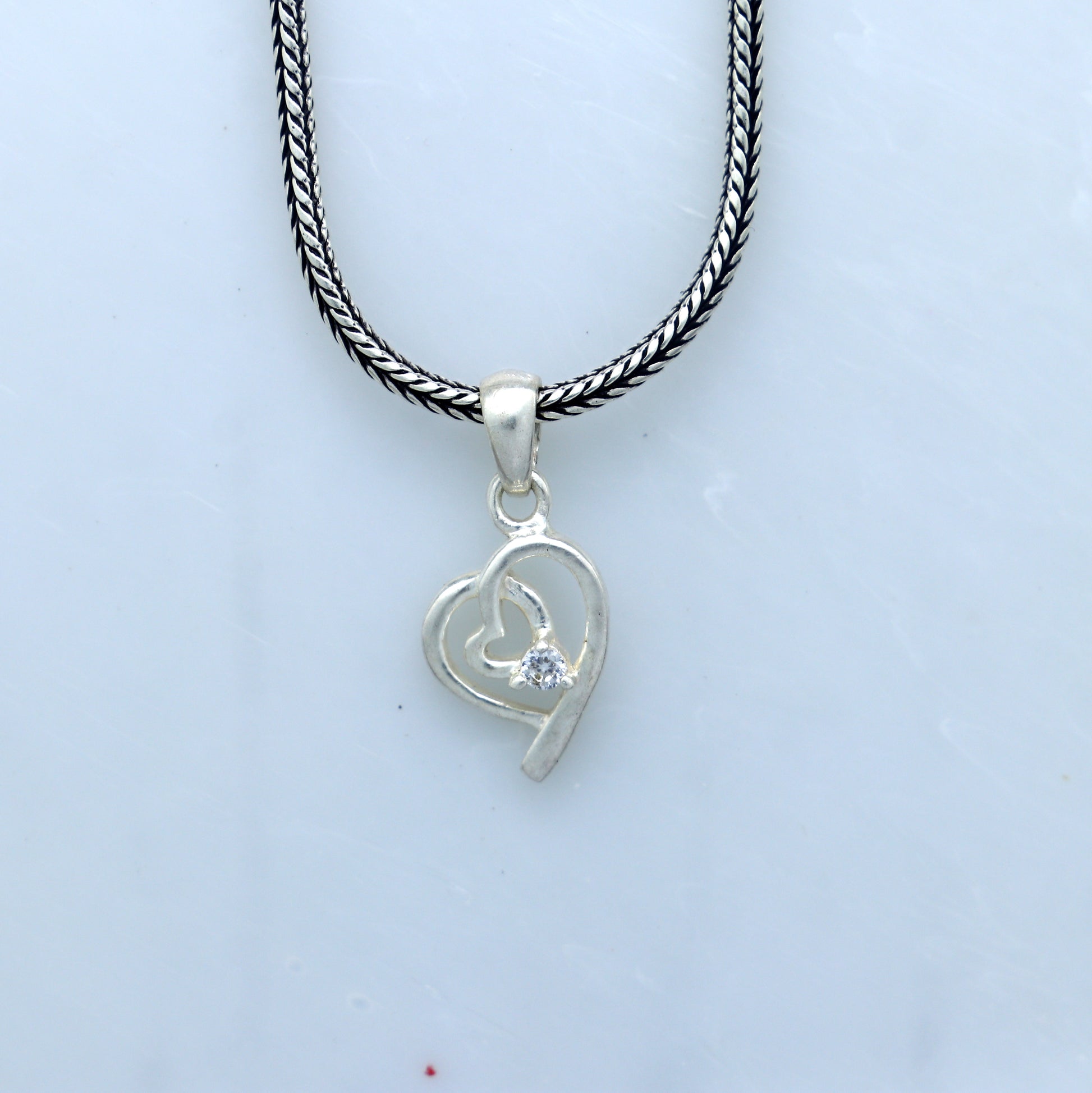 925 Sterling silver diamond heart pendant featuring a delicate tribal design, perfect for elegant jewelry collection.