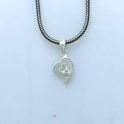 Sterling silver diamond heart pendant by Tribal Ornaments, featuring intricate heart design and sparkling embedded diamonds.