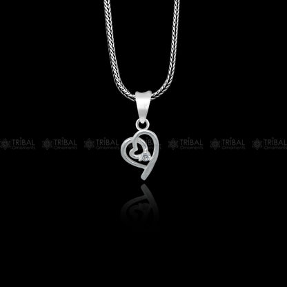 925 Sterling silver heart-shaped pendant with diamond accents by Tribal Ornaments, featuring intricate tribal design details.