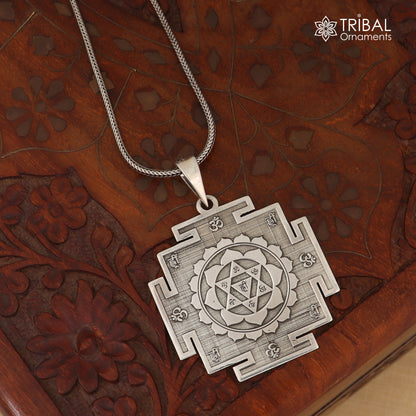 925 sterling silver Divine Baglamukhi Maha Yantram pendant, intricate tribal design, energetic Kavacham charm, on a silver chain.