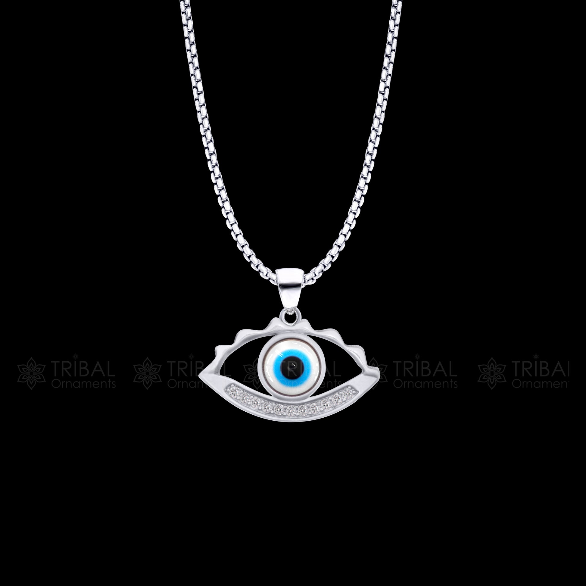 925 sterling silver evil eyes pendant with CZ stone by TRIBAL ORNAMENTS, featuring intricate tribal design and eye-catching sparkle.