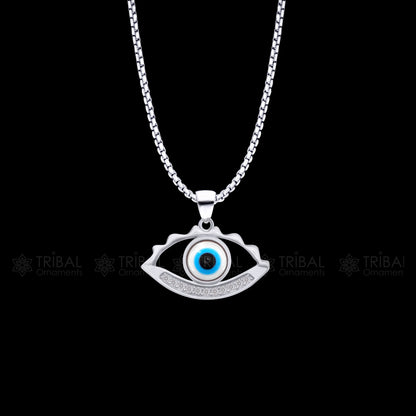 925 sterling silver evil eyes pendant with CZ stone by TRIBAL ORNAMENTS, featuring intricate tribal design and eye-catching sparkle.