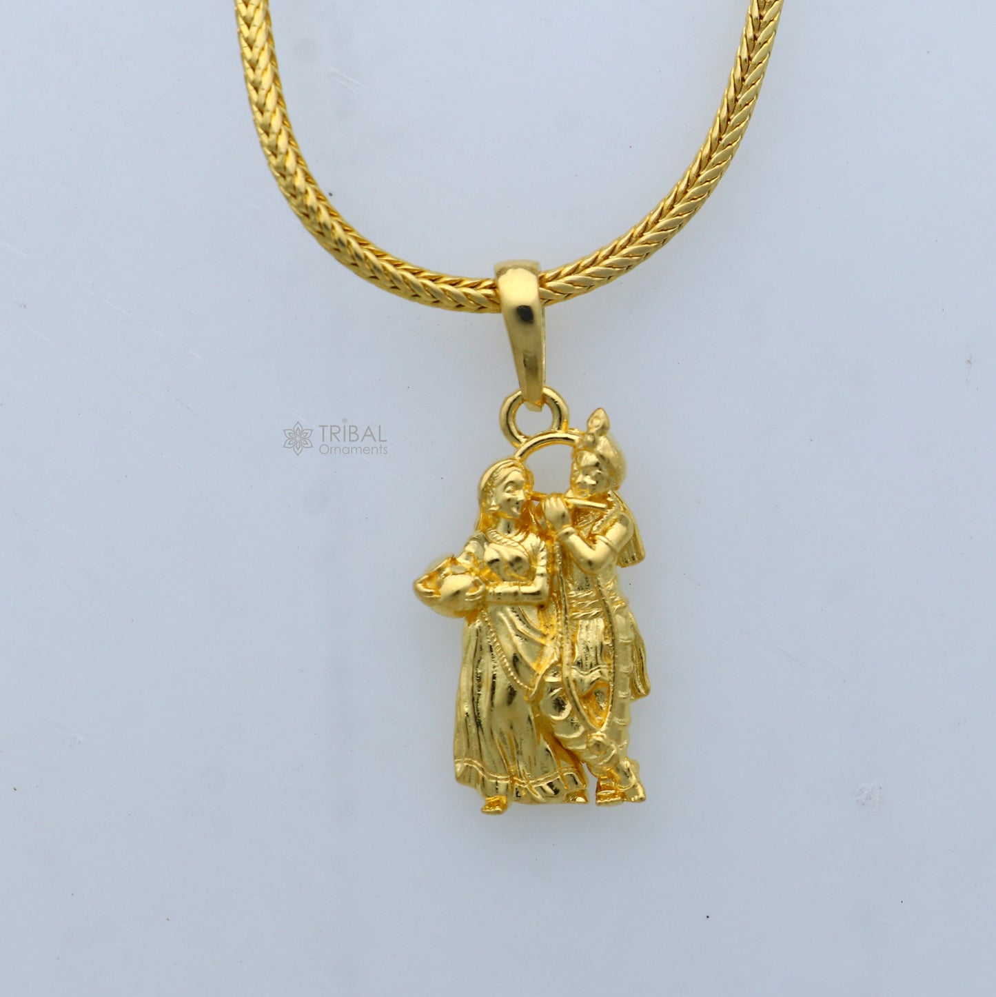Sterling silver Lord Krishna and Radha pendant with gold polish, divine design, crafted by TRIBAL ORNAMENTS.
