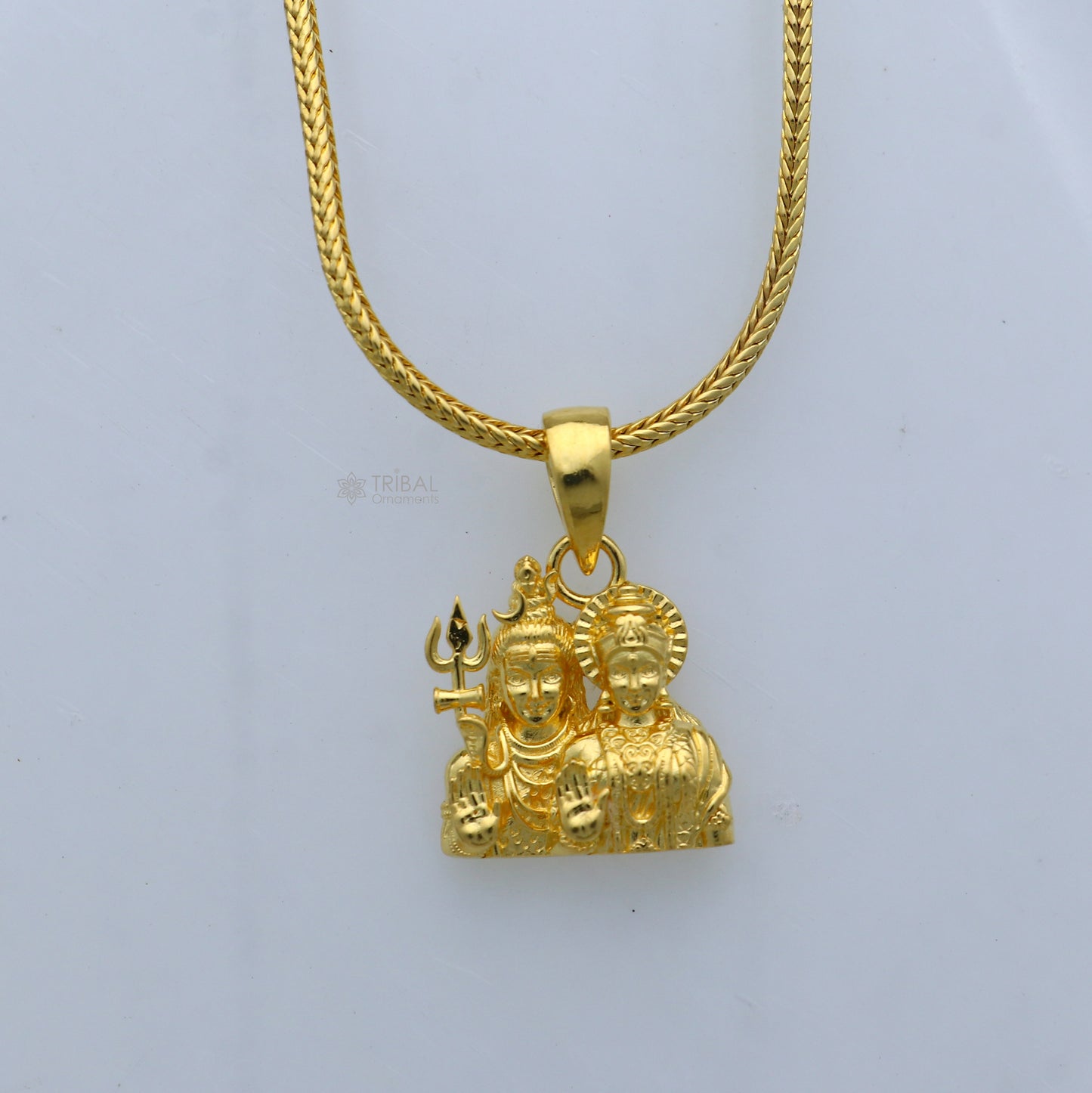 Sterling silver gold-polished Lord Shiva and Parwati Maa divine pendant by Tribal Ornaments featuring intricate religious design.