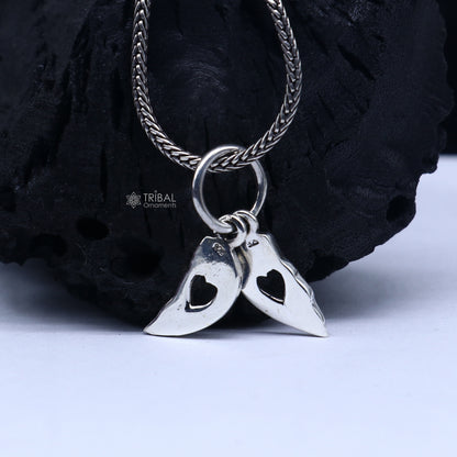 Handmade 925 Sterling silver broken heart pendant by TRIBAL ORNAMENTS, showcasing unique tribal-inspired design.