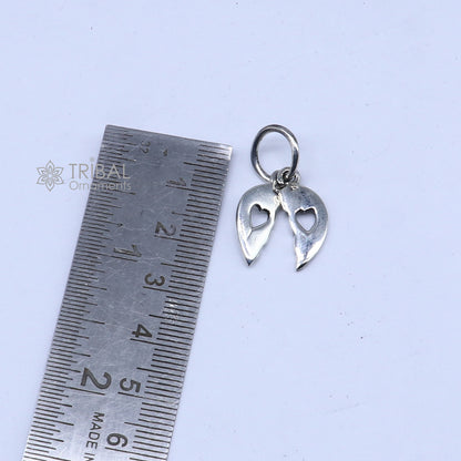Handmade 925 Sterling silver broken heart pendant by TRIBAL ORNAMENTS, showcasing intricate tribal design and craftsmanship.