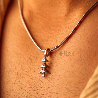 Sterling silver handmade Christmas tree pendant necklace by TRIBAL ORNAMENTS, featuring a unisex design with chain on a silver background.
