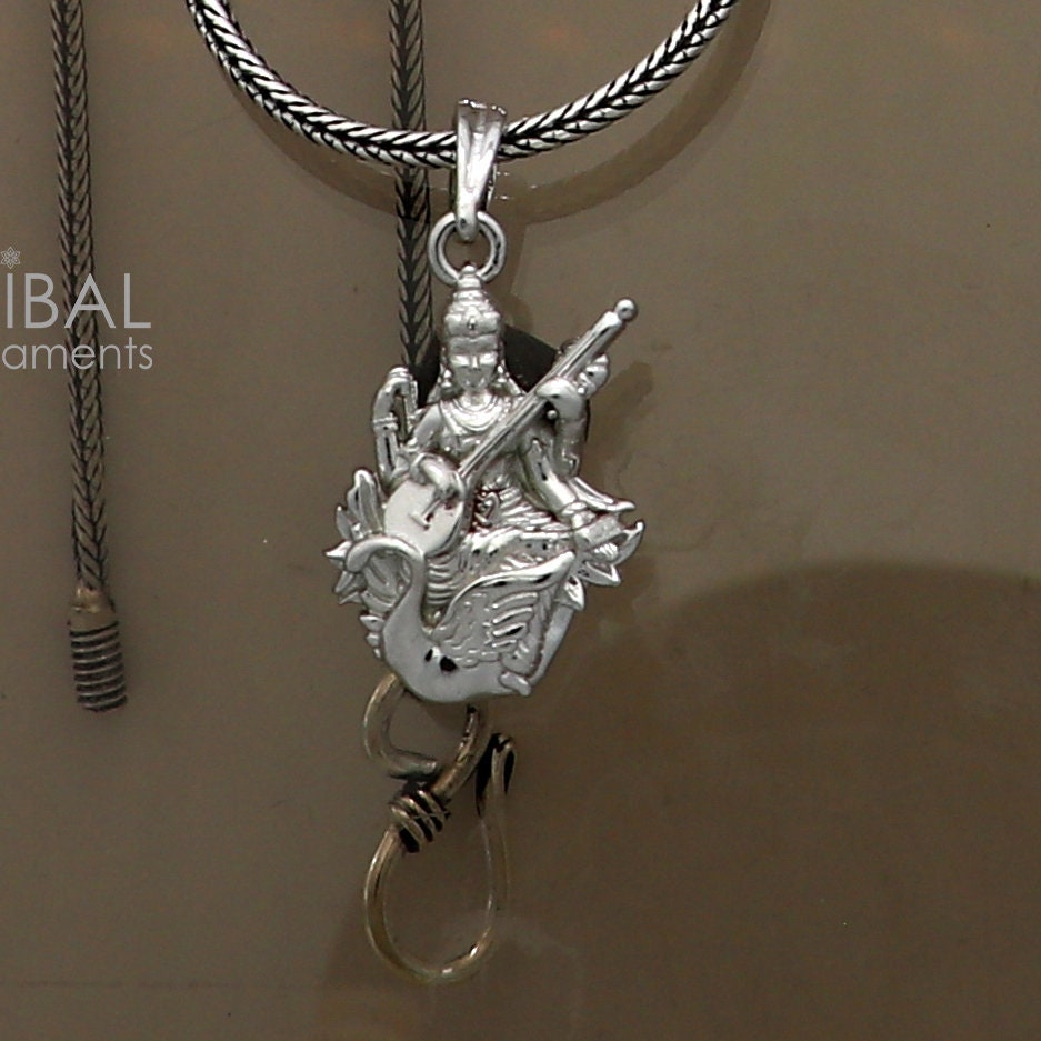 Sterling silver Goddess Saraswati Maa pendant from TRIBAL ORNAMENTS, showcasing intricate divine design for elegant gifting jewelry.