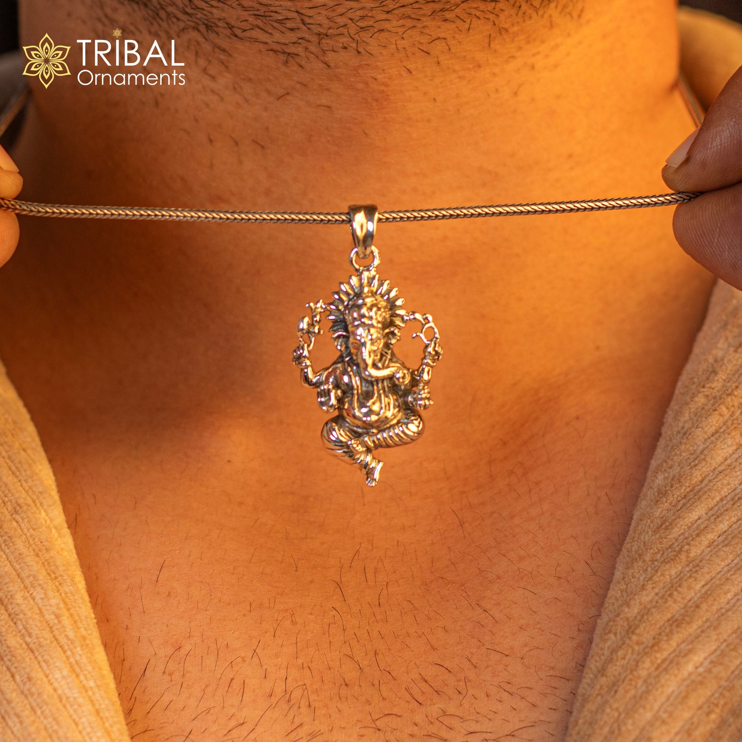 Sterling silver Lord Ganesha pendant by TRIBAL ORNAMENTS, handmade unisex jewelry featuring a detailed Ganesha idol design.