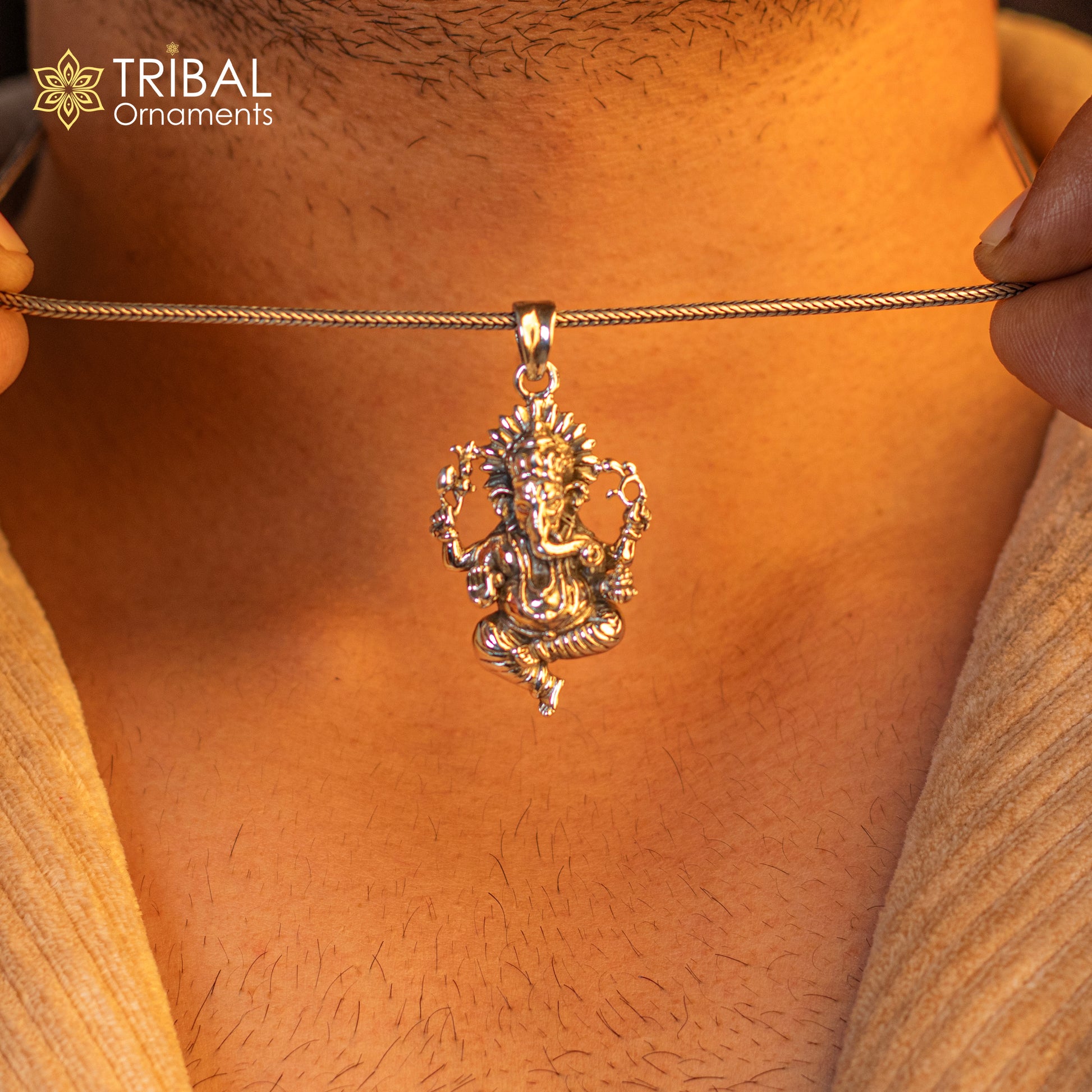 Sterling silver Lord Ganesha pendant by TRIBAL ORNAMENTS, handmade unisex jewelry featuring a detailed Ganesha idol design.