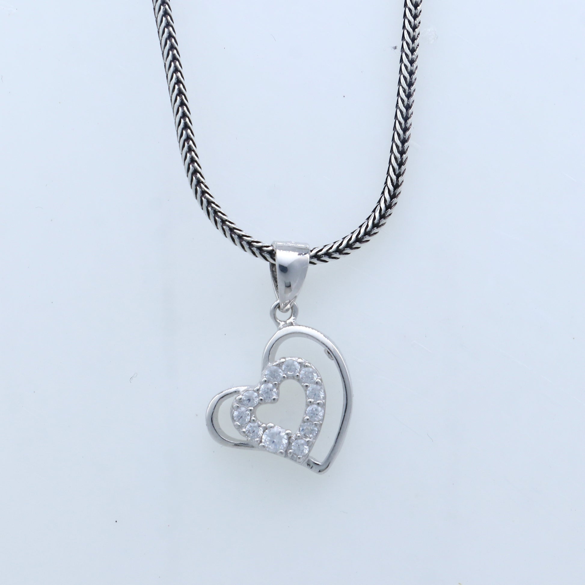Handmade 925 sterling silver heart pendant with tribal ornament design, crafted by TRIBAL ORNAMENTS.
