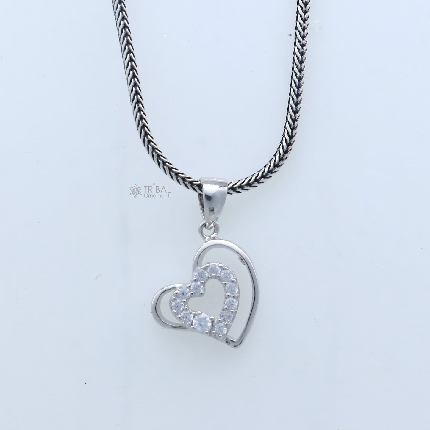 Handmade 925 sterling silver heart pendant with tribal design by TRIBAL ORNAMENTS, showcasing intricate craftsmanship.