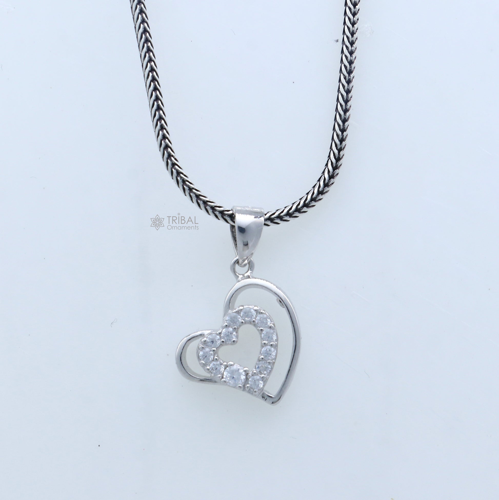 Handmade 925 sterling silver heart pendant with tribal design by TRIBAL ORNAMENTS, showcasing intricate craftsmanship.