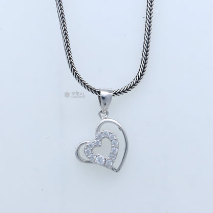 Handmade 925 sterling silver heart pendant with tribal design by TRIBAL ORNAMENTS, showcasing intricate craftsmanship.