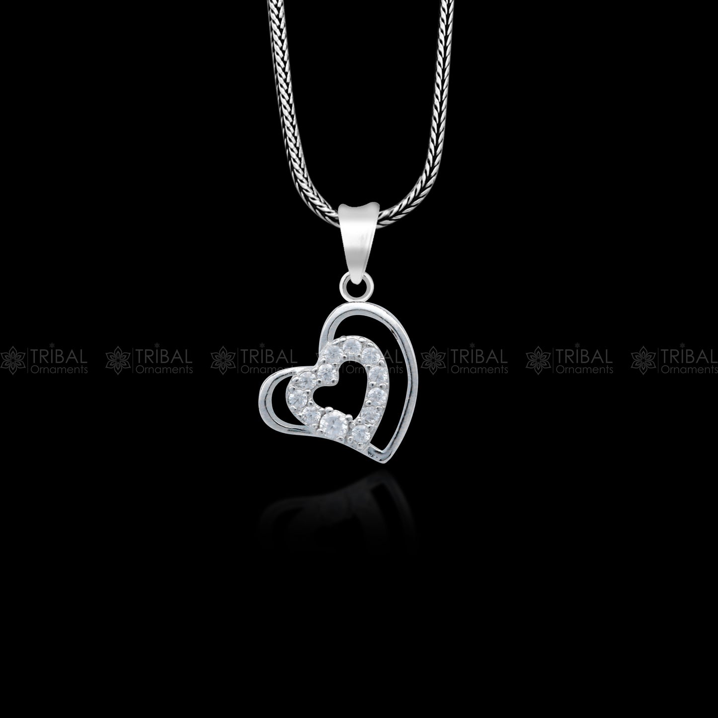 Handmade 925 sterling silver heart pendant with tribal design by TRIBAL ORNAMENTS, showcasing intricate craftsmanship.